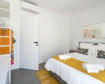 villa-bonita-weiss-gelbes-doppelbett.jpg