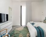 villa-bonita-gruen-weisses-bett.jpg