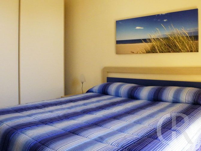 ferienwohnung-eolo-schlafzimmer-mit-doppelbett.jpg