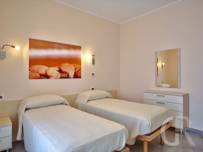 ferienwohnung-arance-schlafzimmer-mit-zwei-einzelbetten.jpg