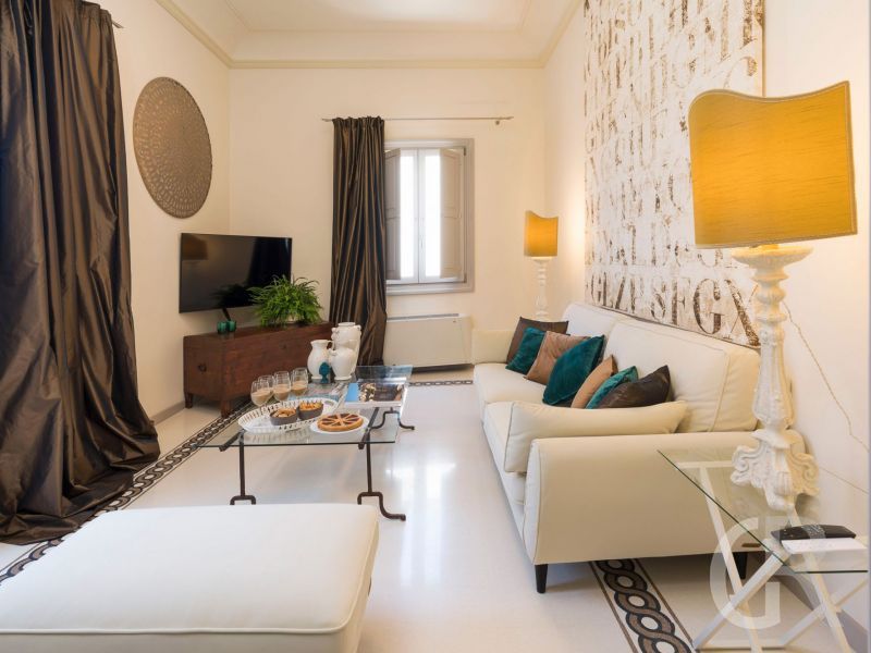 ferienwohnung-dimora-wohnraum-mit-sofa.jpg