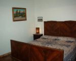 ferienhaus-gelso-schlafzimmer-mit-doppelbett.jpg
