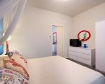 ferienwohnung-corallo-weisses-bett.jpg
