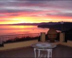 ferienwohnung-luana-dachterrasse-bei-daemmerung.jpg