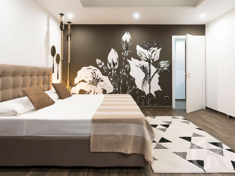 villa-artemare-braun-weisses-schlafzimmer.jpg