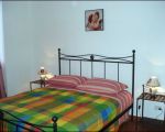 ferienwohnung-franco-schlafzimmer-mit-doppelbett.jpg