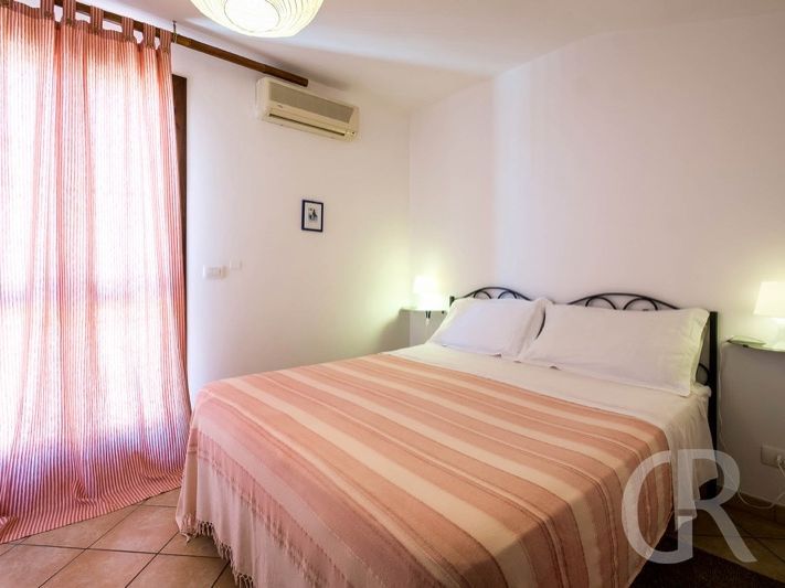 casa-grecale-schlafbereich-mit-doppelbett.jpg