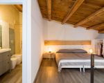 ferienhaus-dimora-pura-schlafzimmer-im-dachgeschoss.jpg