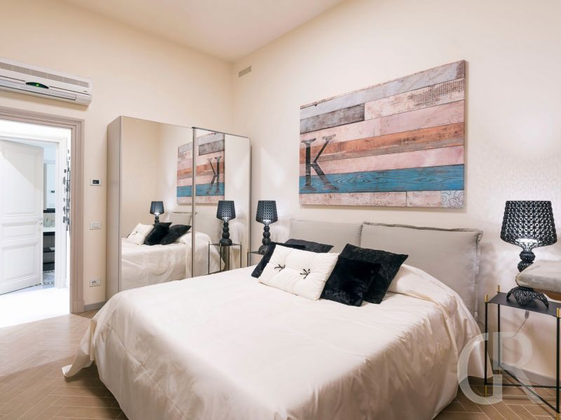 ferienwohnung-dimora-schlafzimmer-mit-doppelbett.jpg