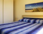 ferienwohnung-eolo-schlafzimmer-mit-doppelbett.jpg