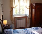 ferienwohnung-la-pagliera-schlafraum.jpg