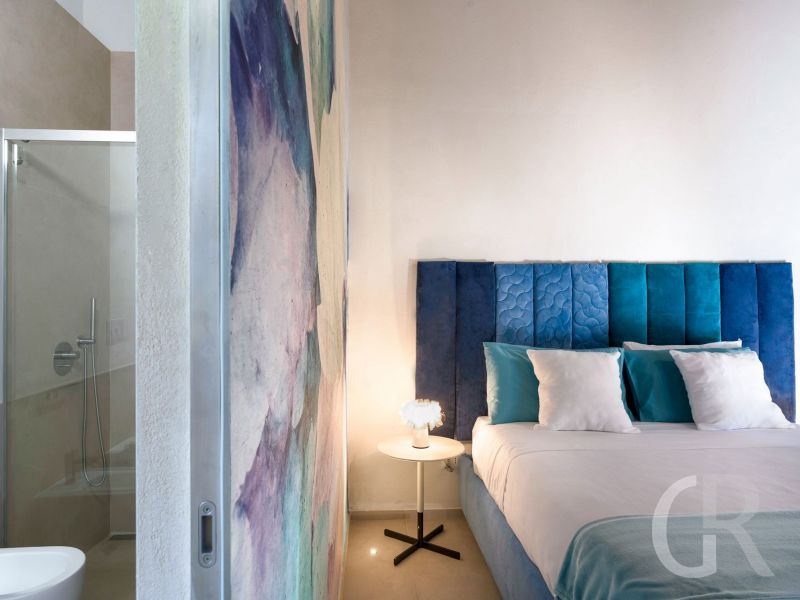 villa-corte-moscata-blaues-doppelbett.jpg