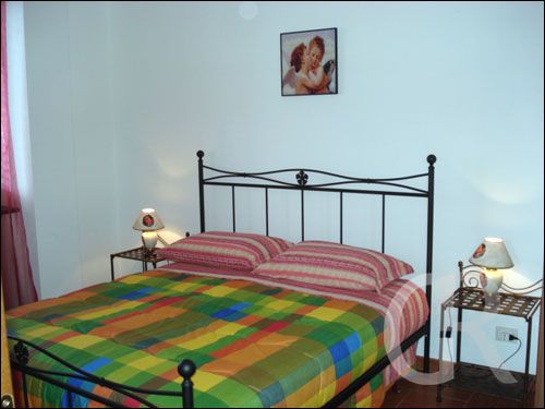 ferienwohnung-franco-schlafzimmer-mit-doppelbett.jpg